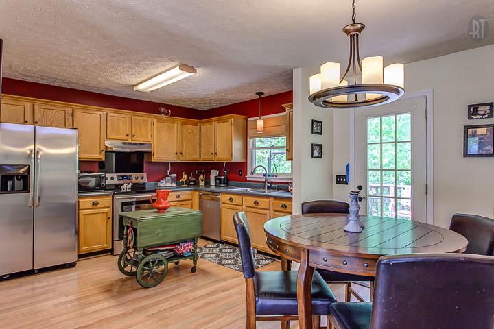 7102 Totty Road Fairview, TN 37062 - Photo 10 of 27 A closer look at breakfast area and large kitchen w/door to treetop deck
