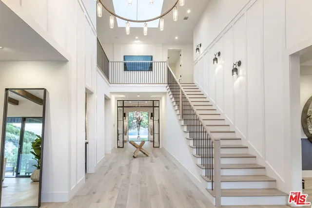 a view of an entryway with wooden floor