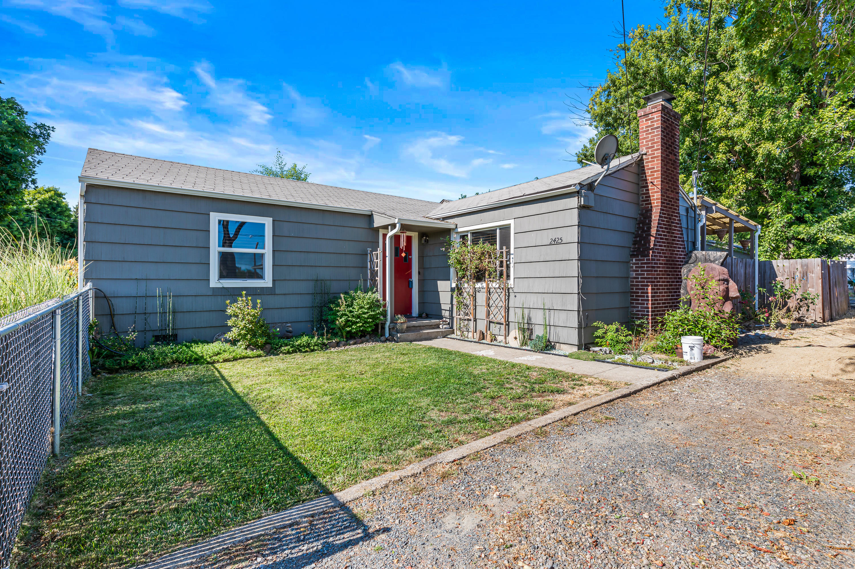 2425 Table Rock Road Medford, OR 97501 - Photo 1 of 26 a front view of a house with a yard