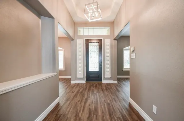 a view of entryway with wooden floor