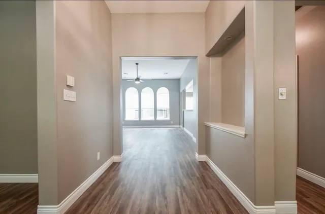 a view of gallery with wooden floor