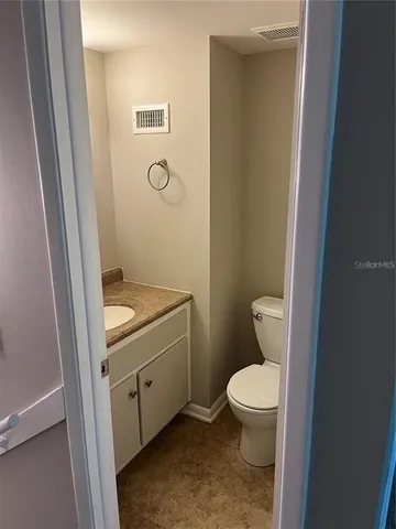 a kitchen with a stove top oven cabinets and a counter top space