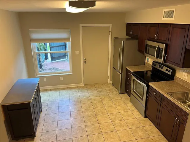 a view of a kitchen from the hallway