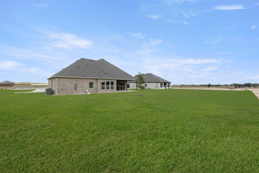132 Evanston Court Rhome, TX 76078 - Photo 40 of 40 132 Evanston-Back-1