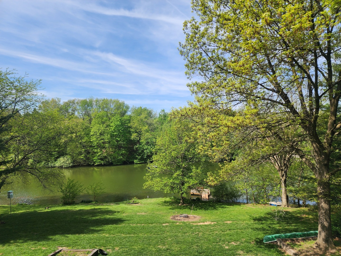 871 Buffalo Run Danvers, IL 61732 - Photo 3 of 8 a view of a lake with a yard