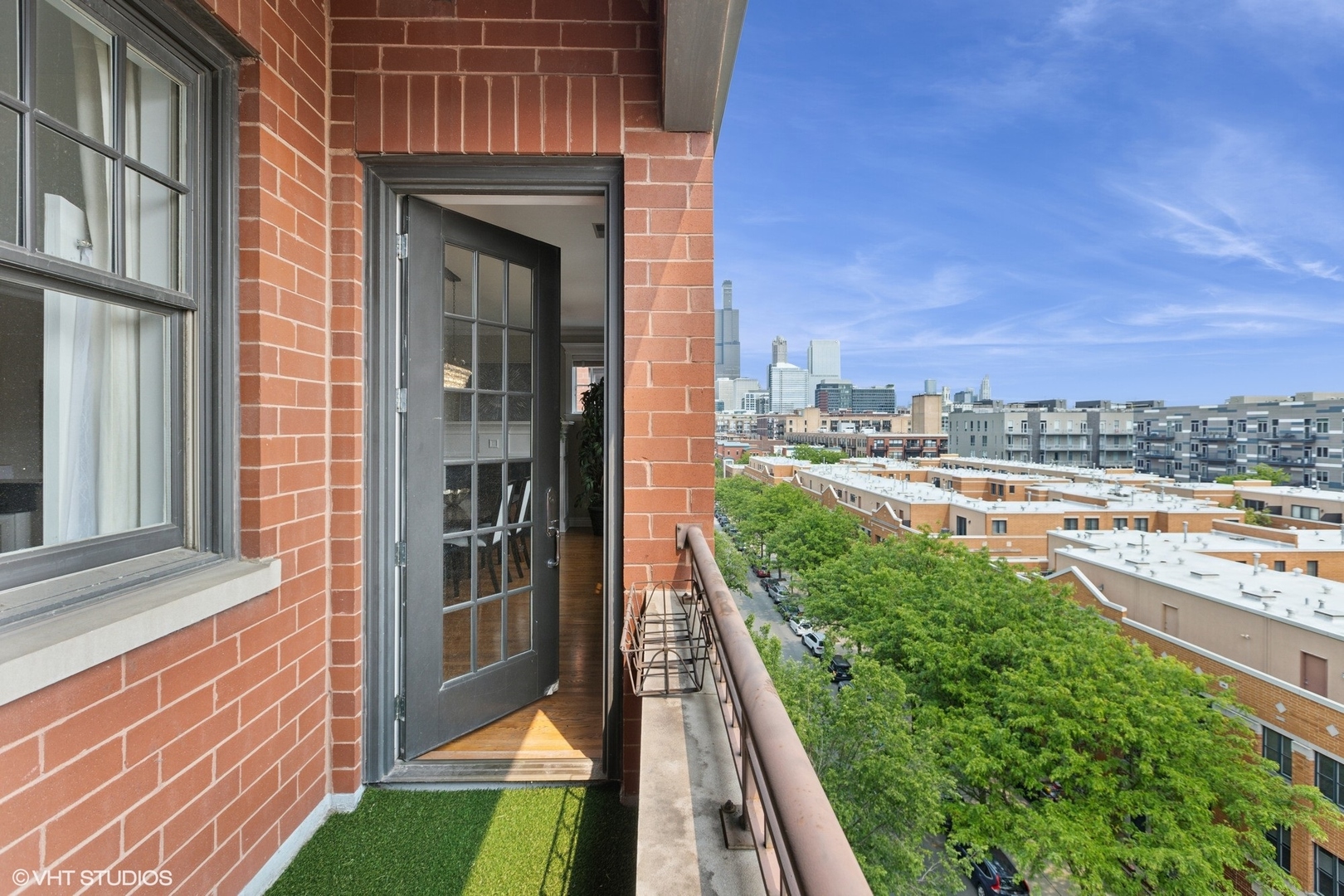 35 South Racine Avenue, Unit 6SE Chicago, IL 60607 - Photo 11 of 26 a view of a balcony with an outdoor seating