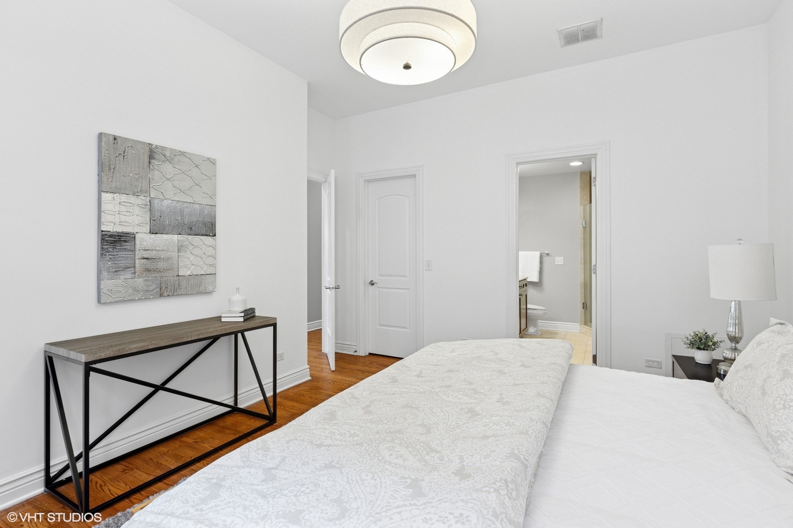 35 South Racine Avenue, Unit 6SE Chicago, IL 60607 - Photo 14 of 26 a bedroom with a bed and a window