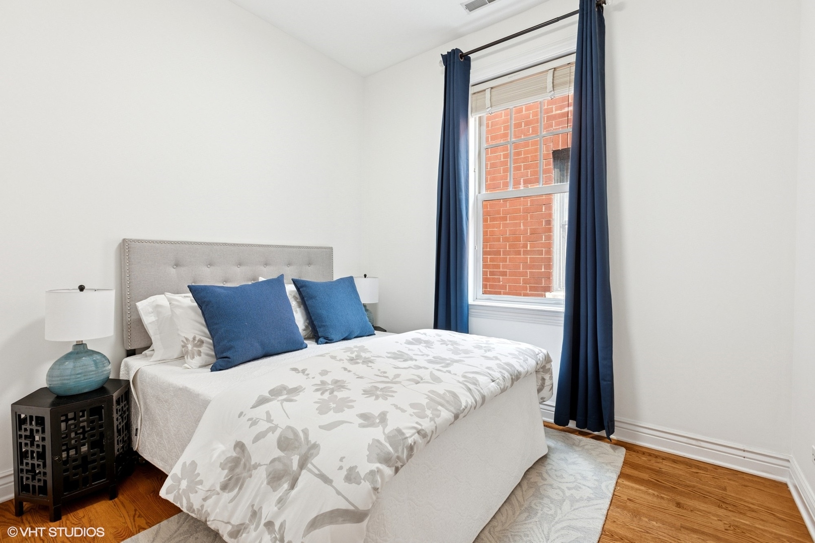 35 South Racine Avenue, Unit 6SE Chicago, IL 60607 - Photo 19 of 26 a large bed sitting in a bedroom next to a window