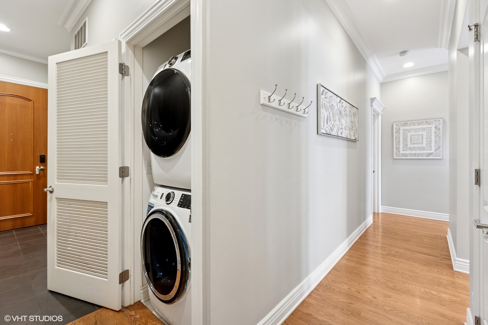 35 South Racine Avenue, Unit 6SE Chicago, IL 60607 - Photo 23 of 26 a view of a hallway with washer and dryer