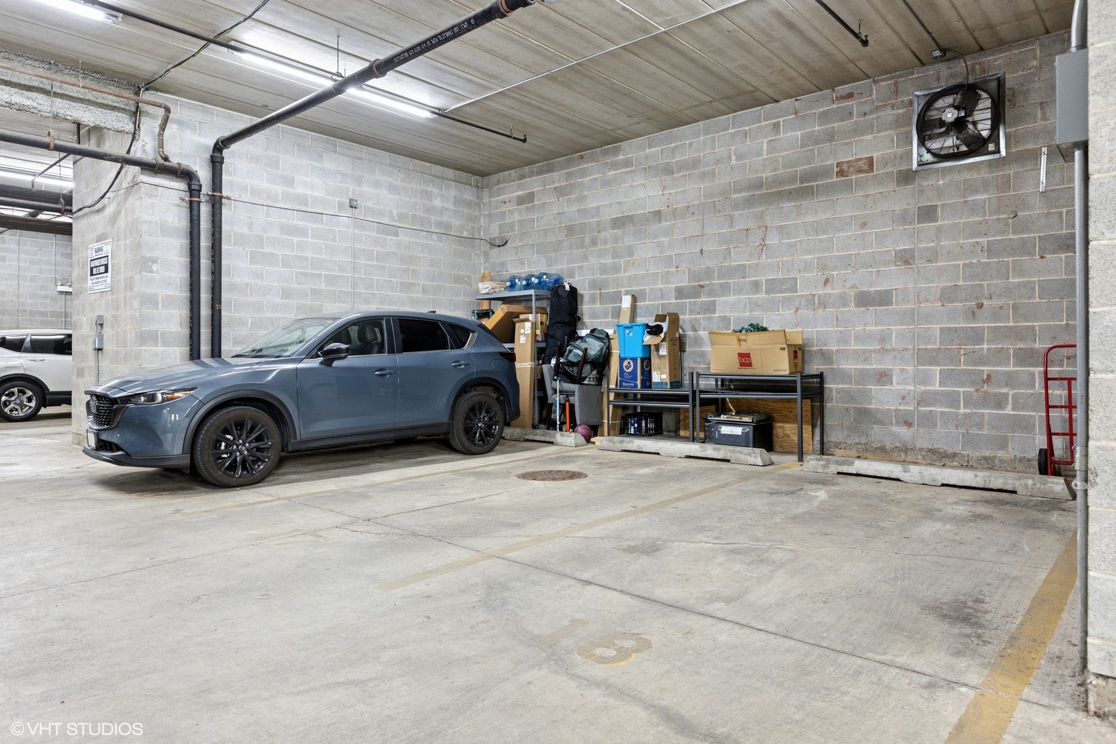 35 South Racine Avenue, Unit 6SE Chicago, IL 60607 - Photo 26 of 26 a view of parking garage with cars
