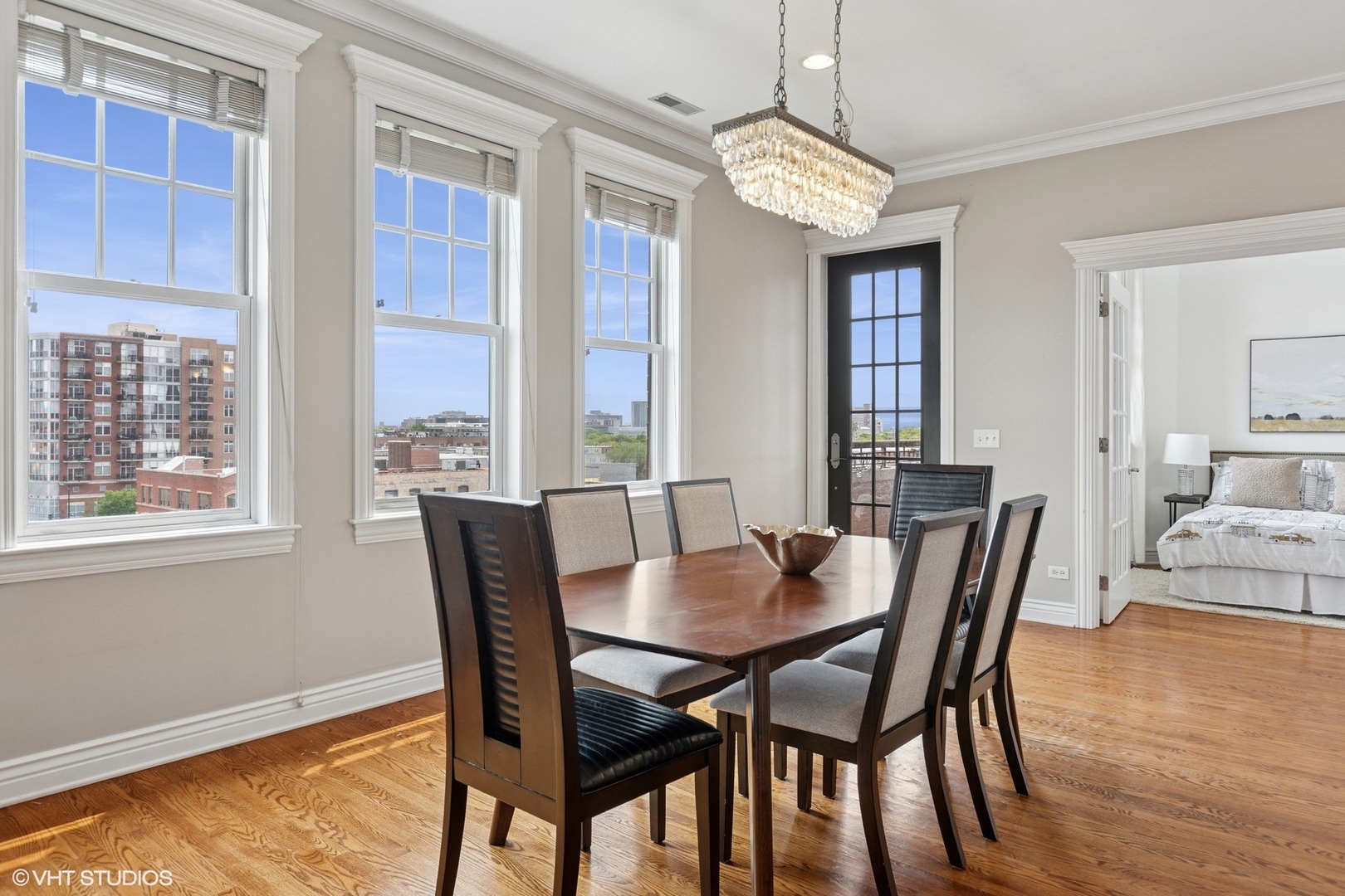 35 South Racine Avenue, Unit 6SE Chicago, IL 60607 - Photo 8 of 26 a view of a dining room with furniture window and wooden floor