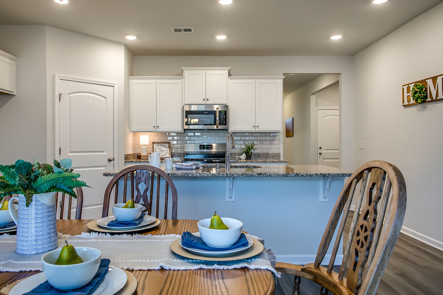 767 Prominence Road Columbia, TN 38401 - Photo 13 of 38 a kitchen with a table chairs and a stove