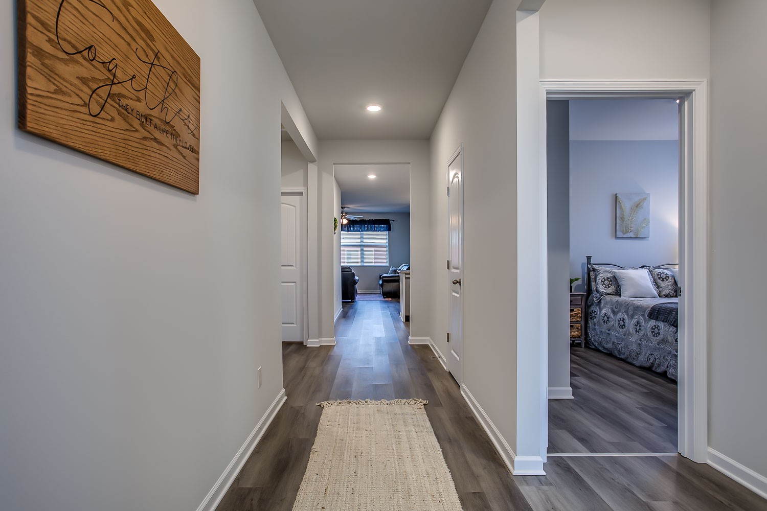 767 Prominence Road Columbia, TN 38401 - Photo 3 of 38 a view of a hallway with wooden floor and a bedroom