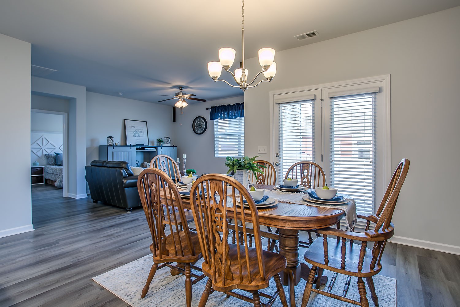 767 Prominence Road Columbia, TN 38401 - Photo 10 of 38 a dining room with furniture a chandelier and wooden floor