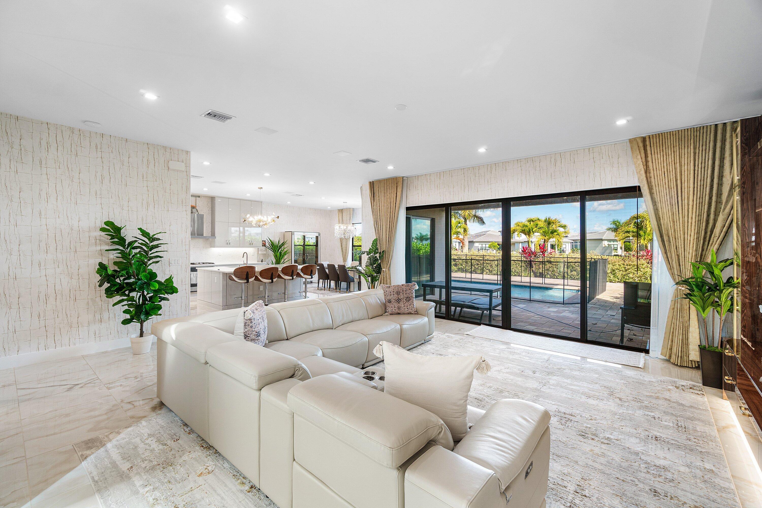 8233 Crystal Downs Avenue Boca Raton, FL 33434 - Photo 7 of 58 a living room with furniture and a large window