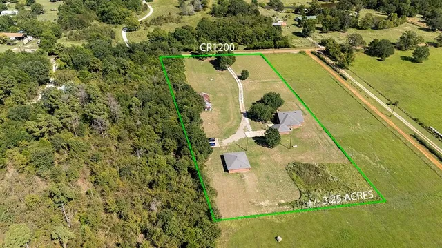 a view of a swimming pool with a yard