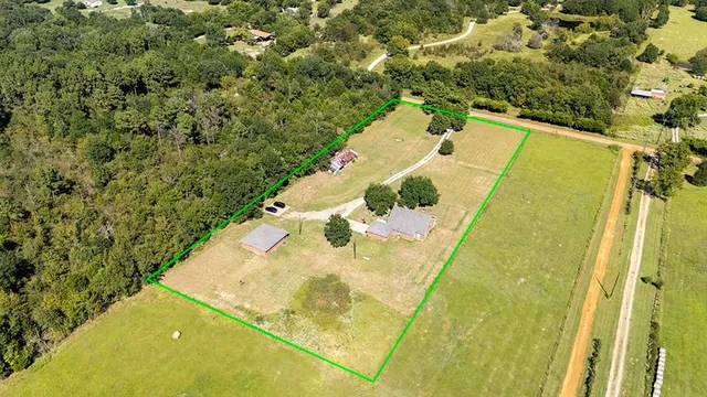 a view of swimming pool with a yard