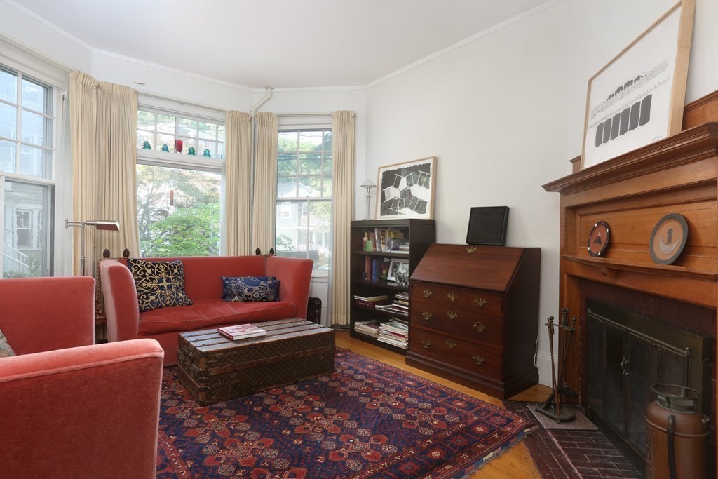 53 Brington Road Brookline, MA 02445 - Photo 2 of 12 a living room with furniture and a fireplace