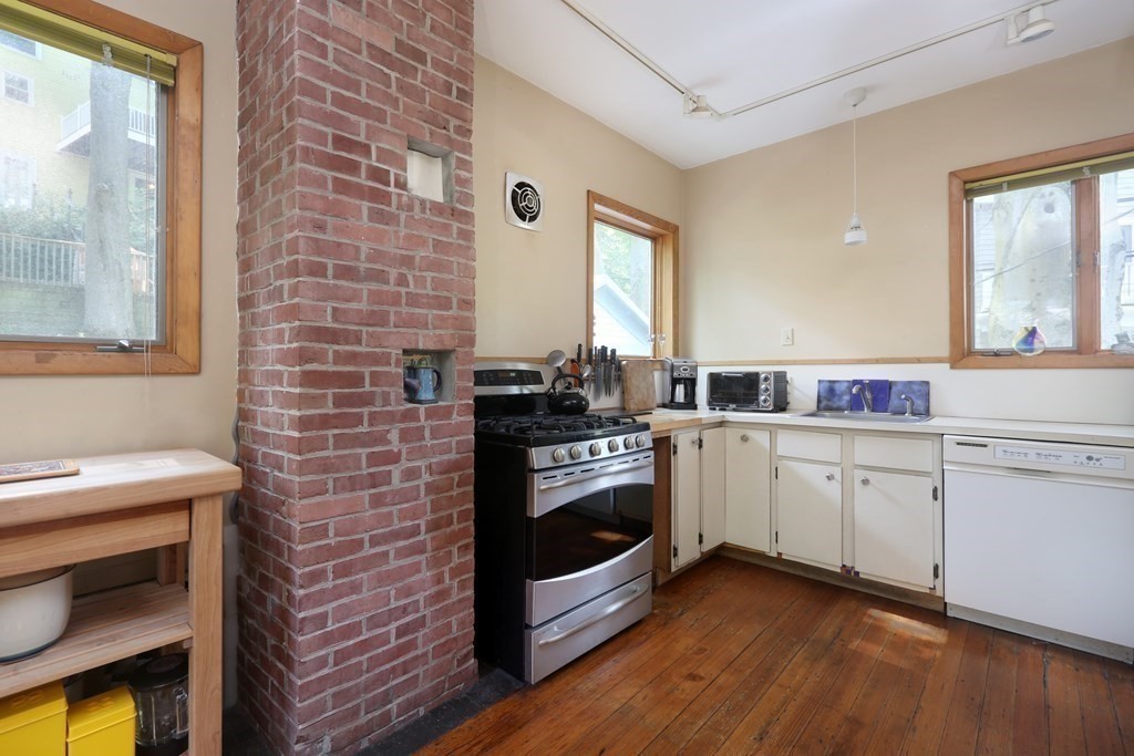 53 Brington Road Brookline, MA 02445 - Photo 5 of 12 a kitchen with a stove oven and sink