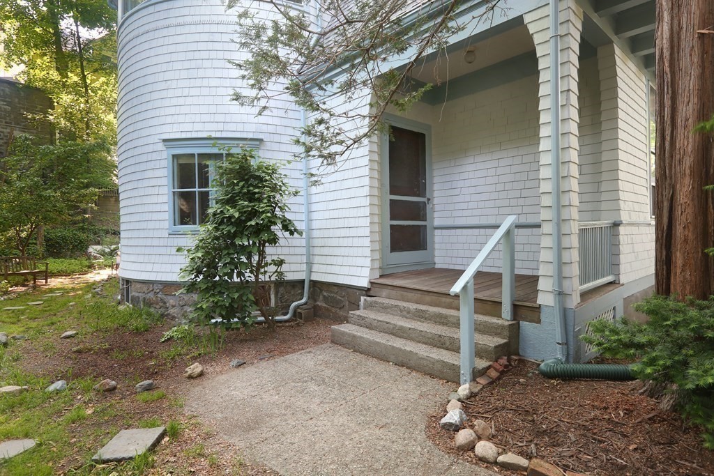 53 Brington Road Brookline, MA 02445 - Photo 10 of 12 a view of a house with backyard and a garden