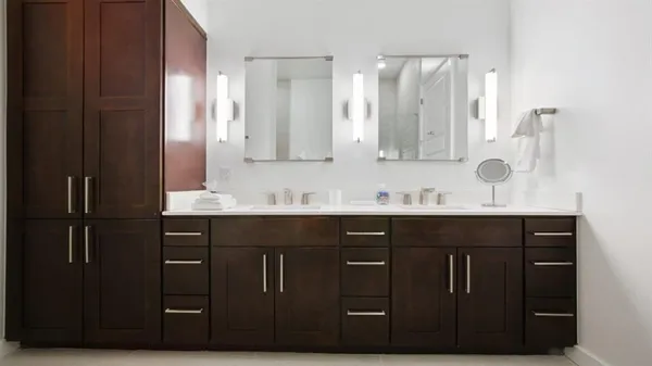 a bathroom with a double vanity sink and mirror