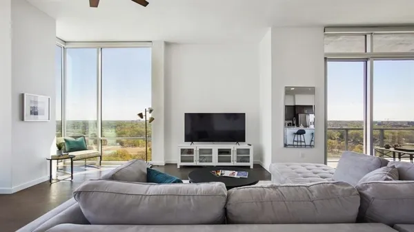 a living room with furniture and a flat screen tv