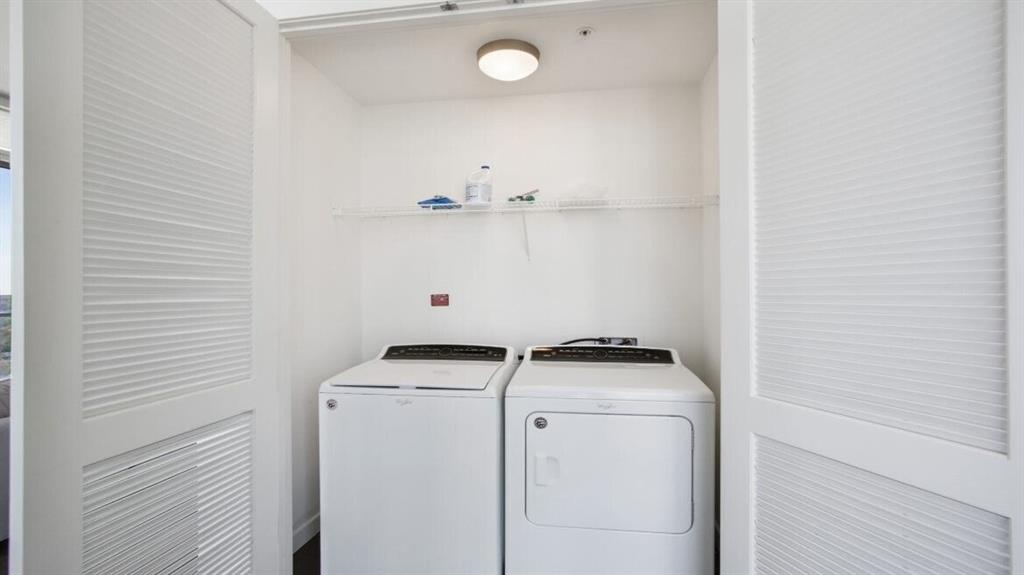 205 12th Street Northeast, Unit 2005 Atlanta, GA 30309 - Photo 23 of 25 a utility room with dryer and washer