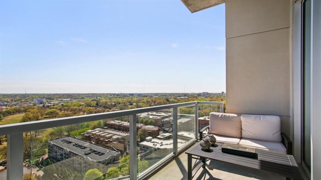 205 12th Street Northeast, Unit 2005 Atlanta, GA 30309 - Photo 24 of 25 a balcony with an outdoor seating