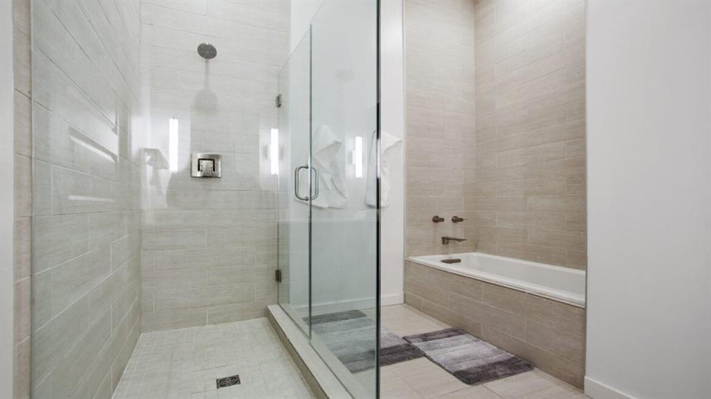 205 12th Street Northeast, Unit 2005 Atlanta, GA 30309 - Photo 25 of 25 a bathroom with a bathtub and a shower