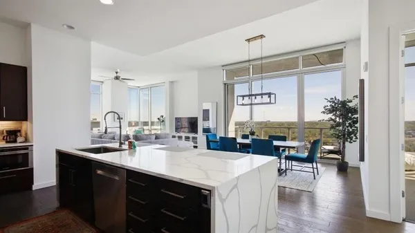 a kitchen with a sink a counter top space and appliances