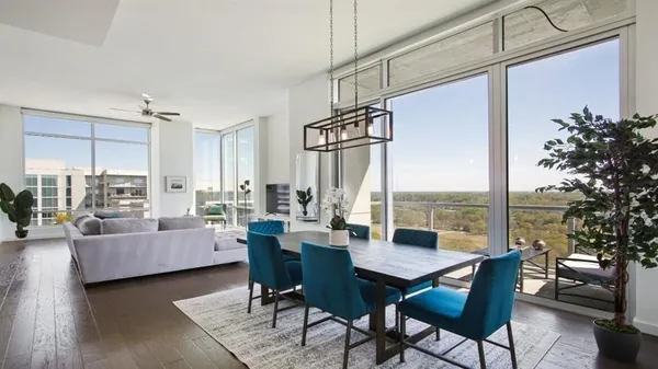 a view of a livingroom with furniture and a table