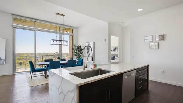 a kitchen with counter top space and sink
