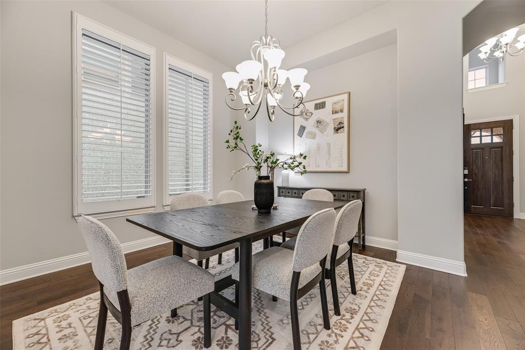 2425 Eclipse Place Celina, TX 75009 - Photo 14 of 40 a view of a dining room with furniture and chandelier