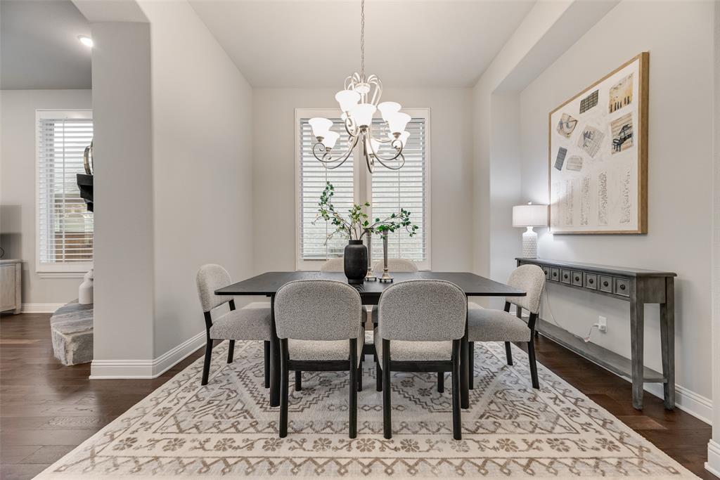 2425 Eclipse Place Celina, TX 75009 - Photo 15 of 40 a view of a dining room with furniture window and wooden floor