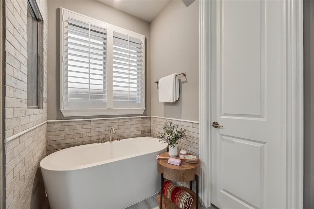2425 Eclipse Place Celina, TX 75009 - Photo 19 of 40 a white bath tub sitting next to a white toilet