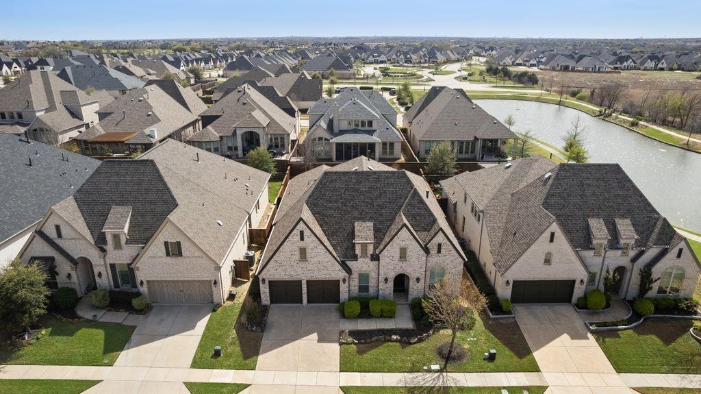 2425 Eclipse Place Celina, TX 75009 - Photo 2 of 40 an aerial view of multiple houses with a yard