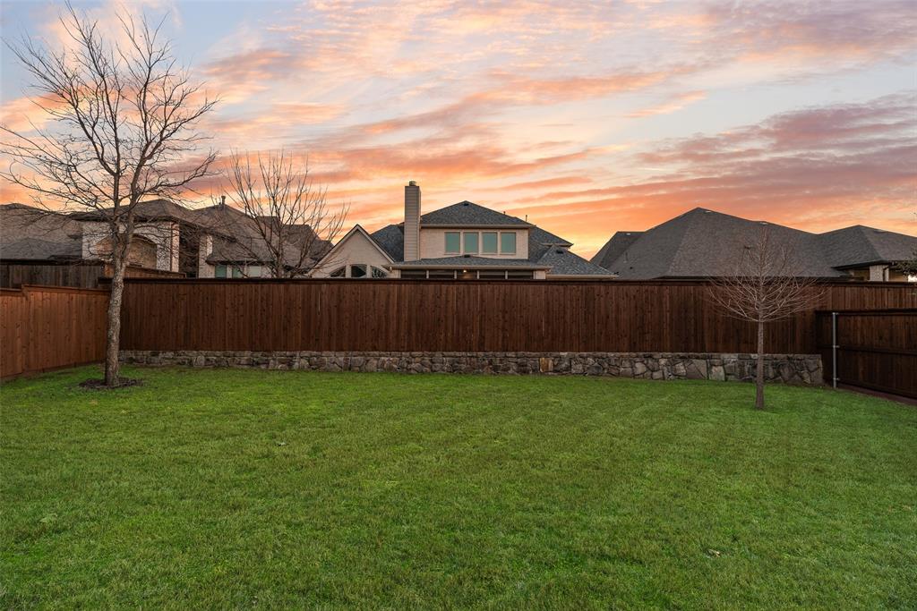 2425 Eclipse Place Celina, TX 75009 - Photo 30 of 40 a view of a yard with wooden fence