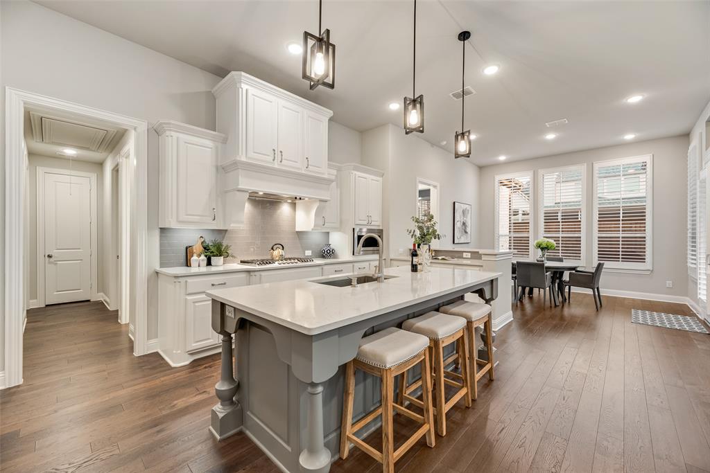 2425 Eclipse Place Celina, TX 75009 - Photo 7 of 40 a large kitchen with a table and chairs