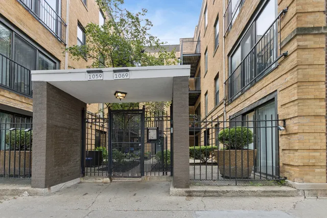 a view of a building with a tree