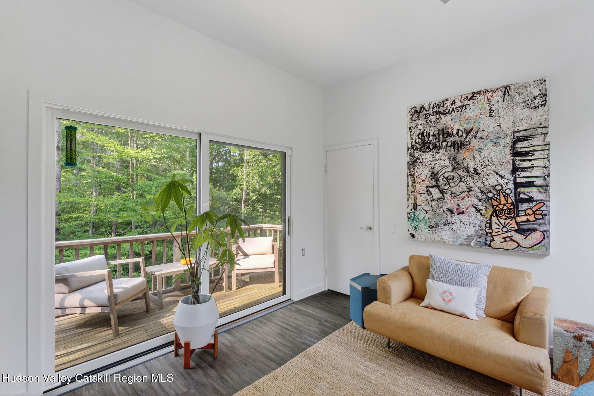 69 Irondale Road Phoenicia, NY 12464 - Photo 15 of 30 a living room with furniture and a large window