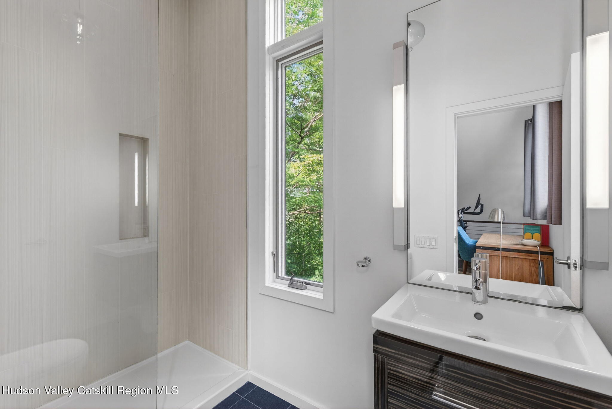 69 Irondale Road Phoenicia, NY 12464 - Photo 17 of 30 a bathroom with a sink and a mirror