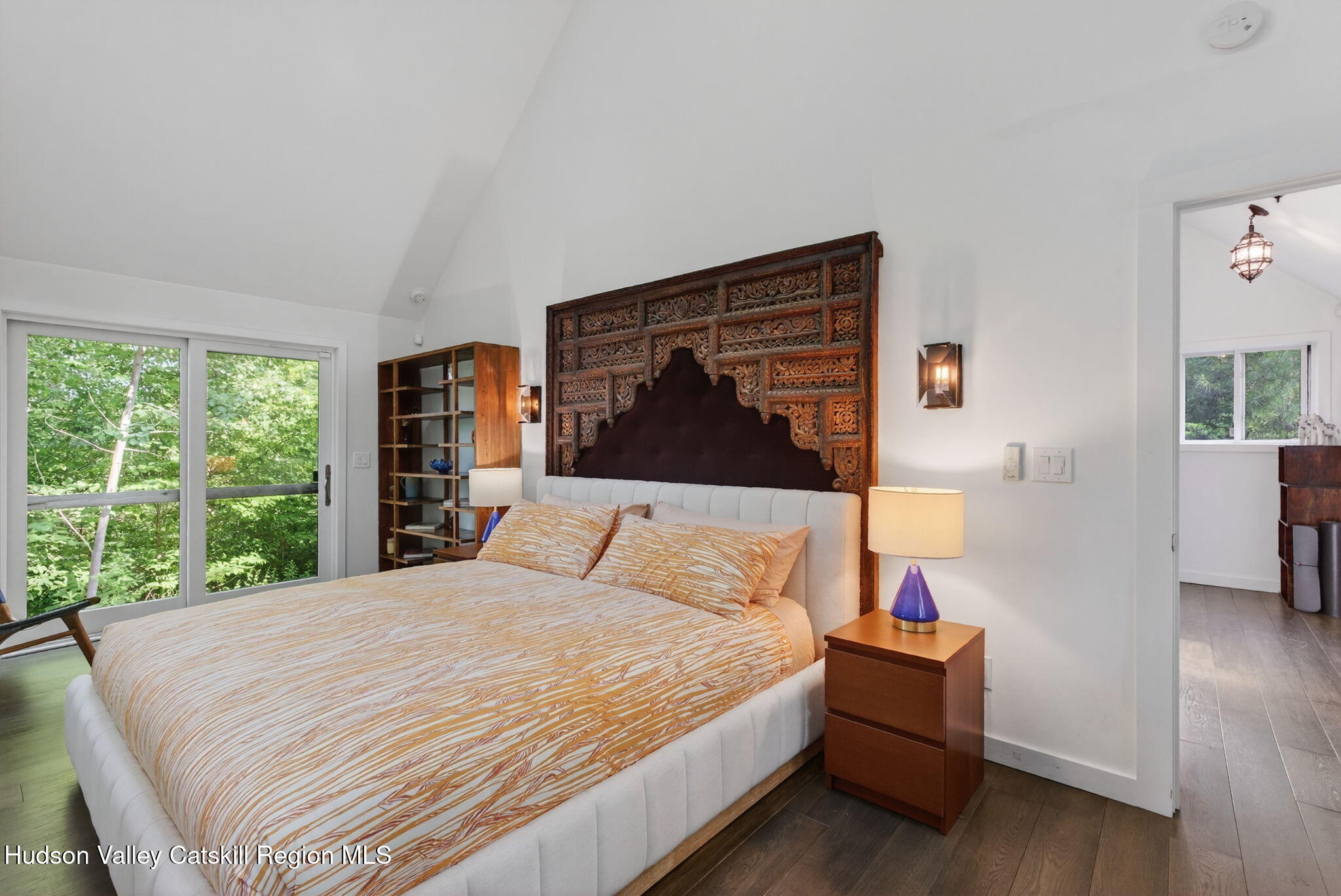 69 Irondale Road Phoenicia, NY 12464 - Photo 19 of 30 a bedroom with a bed and wooden floor