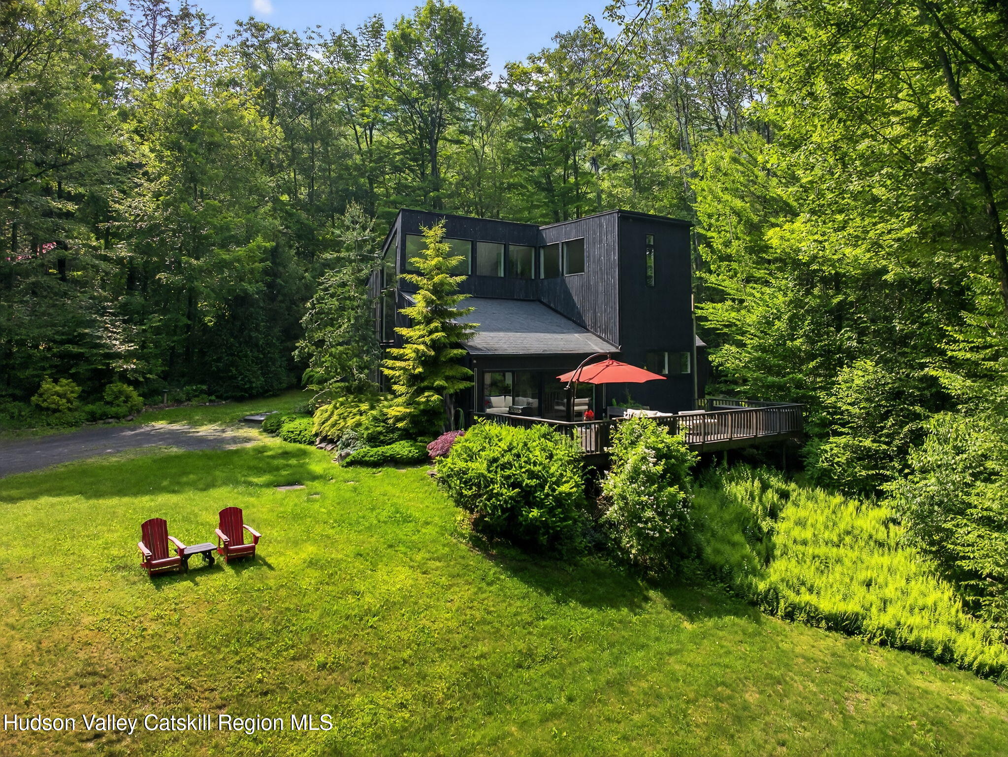 69 Irondale Road Phoenicia, NY 12464 - Photo 2 of 30 a backyard of a house with yard and outdoor seating
