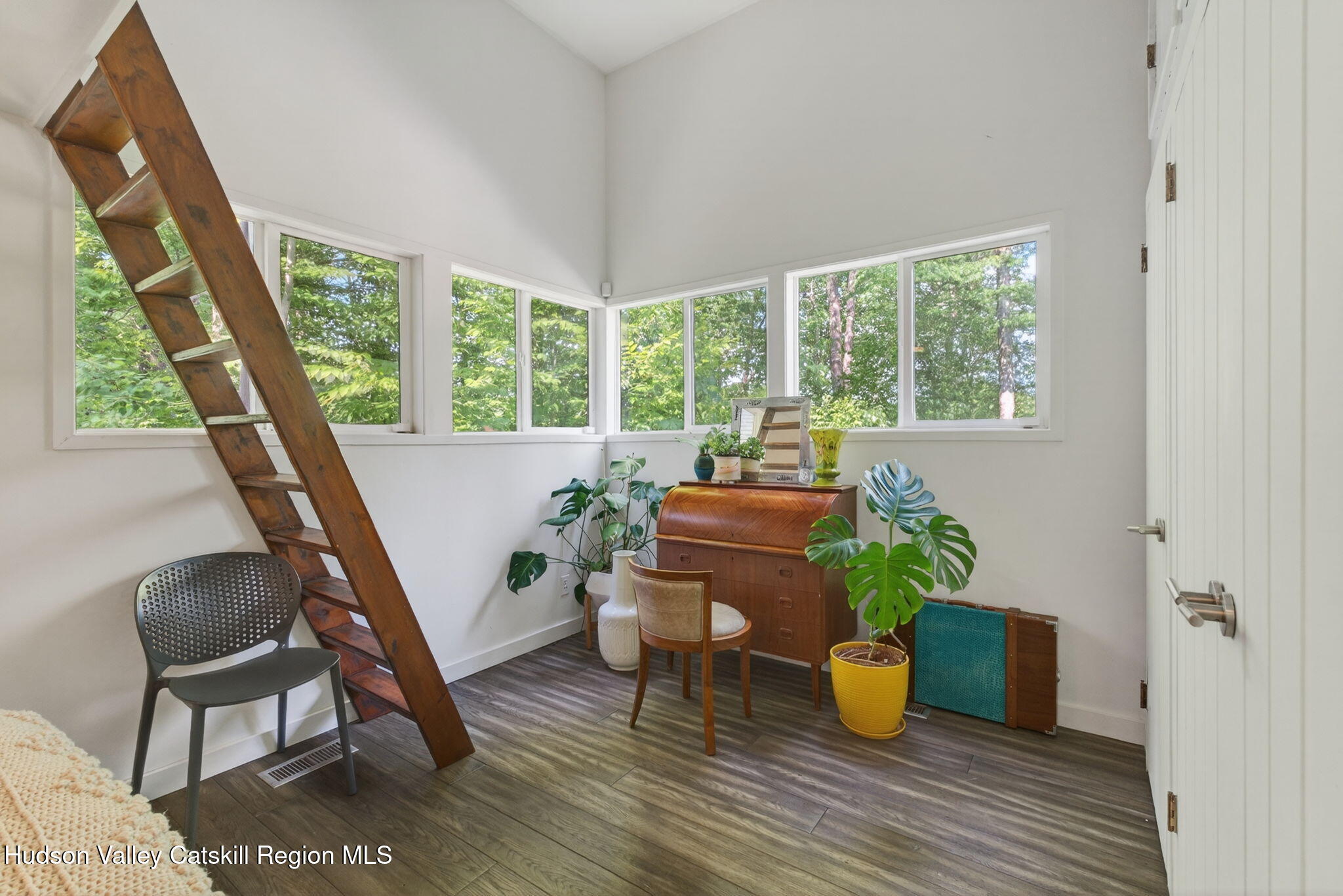 69 Irondale Road Phoenicia, NY 12464 - Photo 22 of 30 a living room with furniture and a potted plant