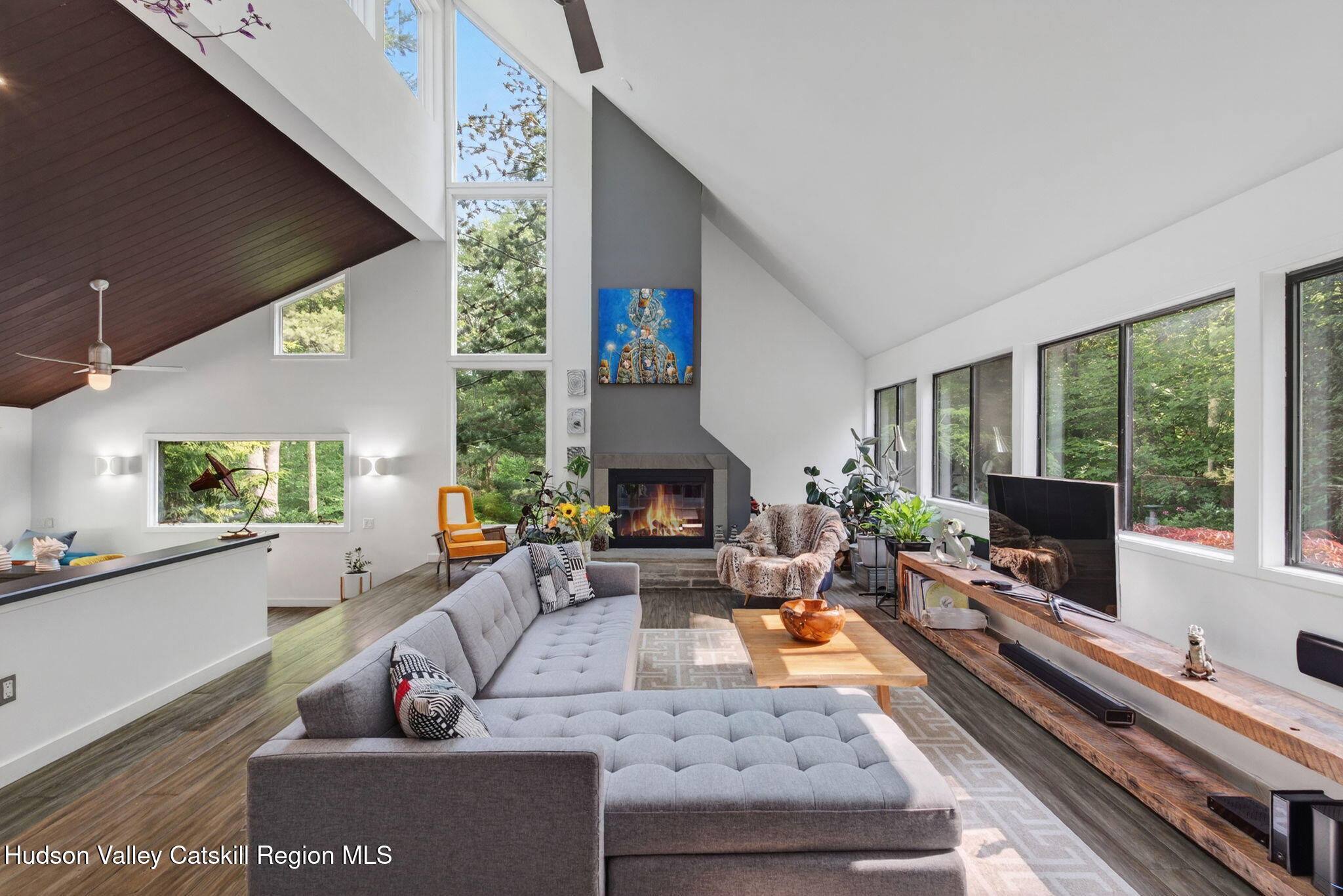 69 Irondale Road Phoenicia, NY 12464 - Photo 5 of 30 a living room with furniture a large window and a fireplace