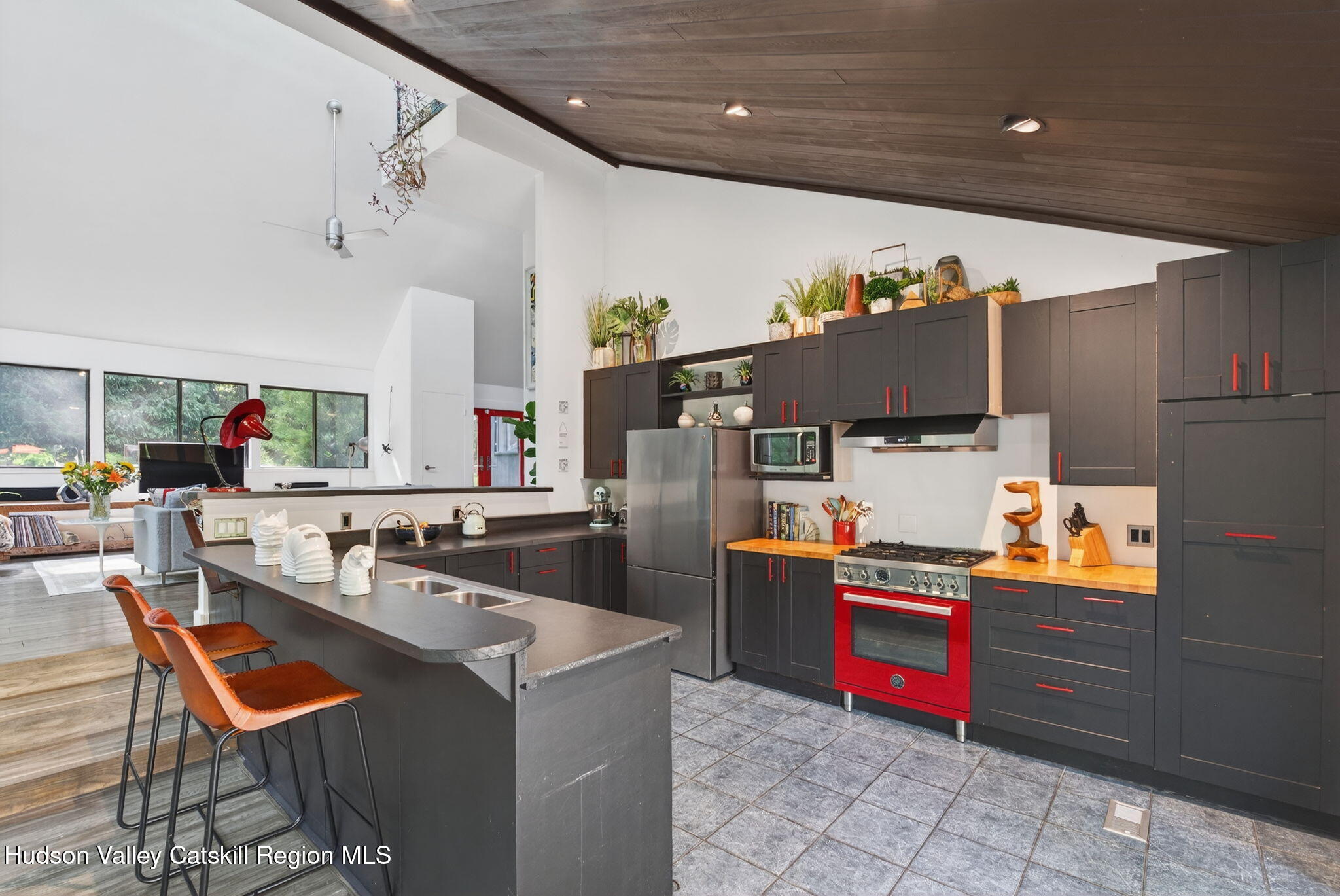 69 Irondale Road Phoenicia, NY 12464 - Photo 9 of 30 a kitchen with stainless steel appliances a stove a refrigerator and a refrigerator