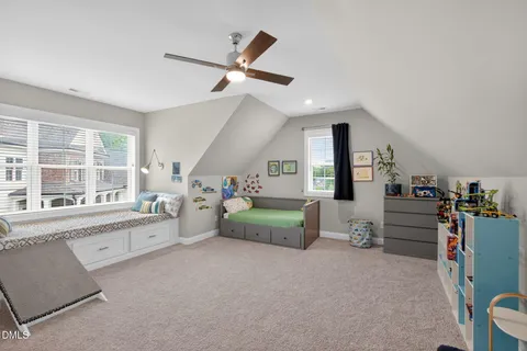 a view of a livingroom with furniture and a ceiling fan