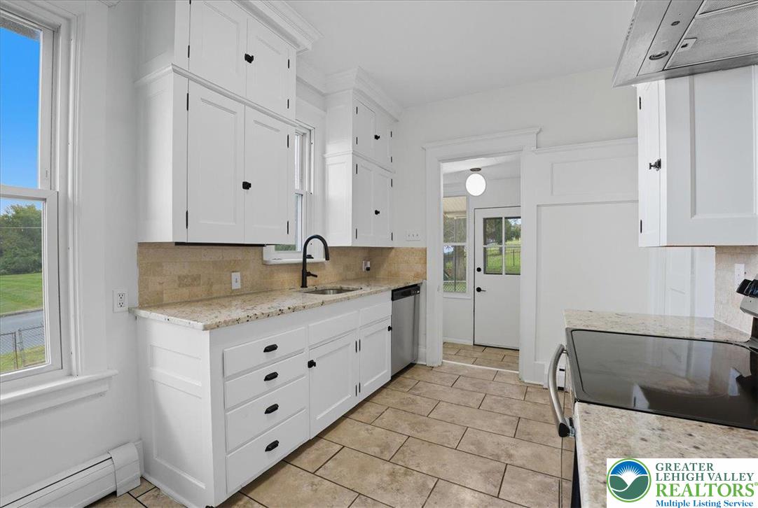 170 South Church Street Nazareth, PA 18064 - Photo 4 of 23 a large white kitchen with granite countertop a sink
