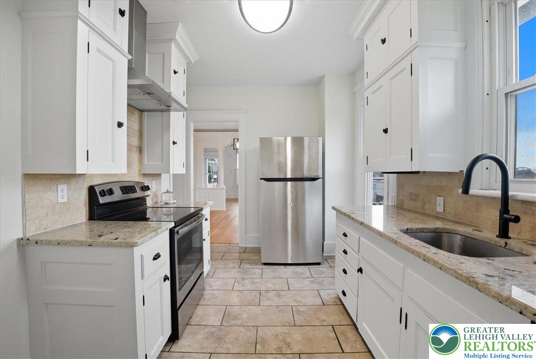 170 South Church Street Nazareth, PA 18064 - Photo 5 of 23 a kitchen with stainless steel appliances granite countertop a refrigerator a stove and a sink