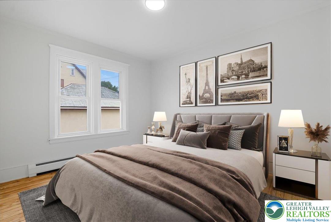 170 South Church Street Nazareth, PA 18064 - Photo 9 of 23 a bedroom with a bed and a painting on the wall